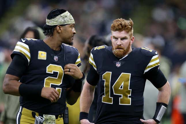 Nov 20, 2022; New Orleans, Louisiana, USA; New Orleans Saints quarterbacks Jameis Winston (2) and Andy Dalton (14) talk in the second half against the New Orleans Saints at the Caesars Superdome.