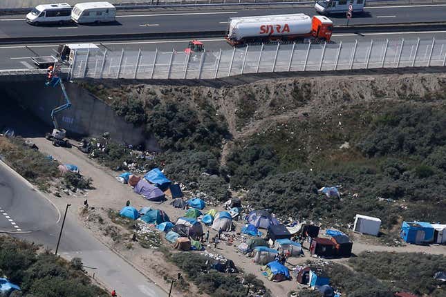 An aerial view shows a field named "new jungle" with tents and makeshift shelters where migrants and asylum seekers stay in Calais, northern France, July 21, 2015.