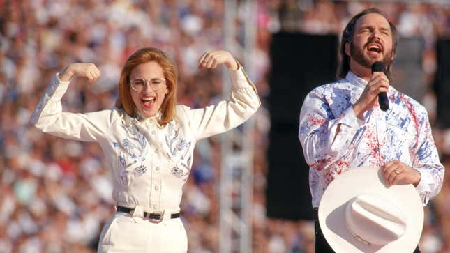 Garth Brooks sings the National Anthem with American sign language translation preformed by actress Marlee Matlin prior to Super Bowl XXVII on January 31, 1993 in Pasadena, California
