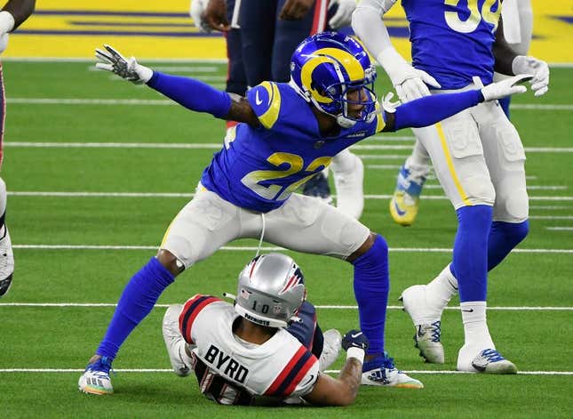 Dec 10, 2020; Inglewood, California, USA; Los Angeles Rams cornerback Troy Hill (22) signals incomplete pass after breaking up a pass play to New England Patriots wide receiver Damiere Byrd (10) during the first quarter at SoFi Stadium.