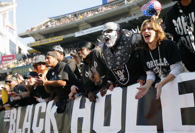 Fans of the Oakland Raiders cheers against the Houston Texans during the game on December 3, 2006 at McAfee Coliseum in Oakland, California.