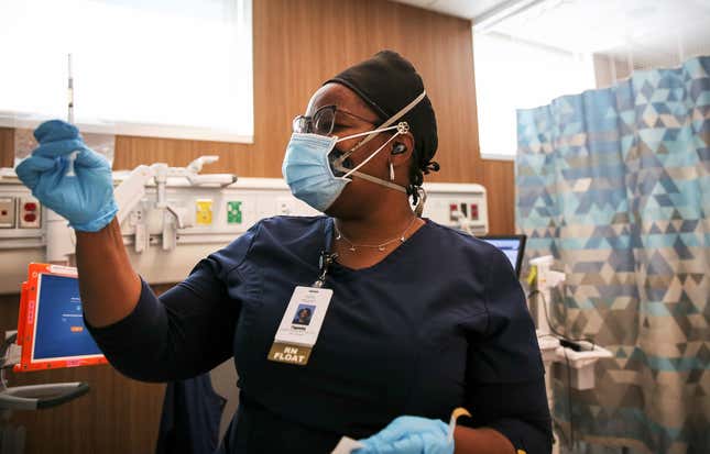 Travel nurse Tiquella Russell of Texas prepares to administer a dose of the COVID-19 vaccine at a clinic at Martin Luther King Jr. Community Hospital in South Los Angeles on February 25, 2021 in Los Angeles, California. 