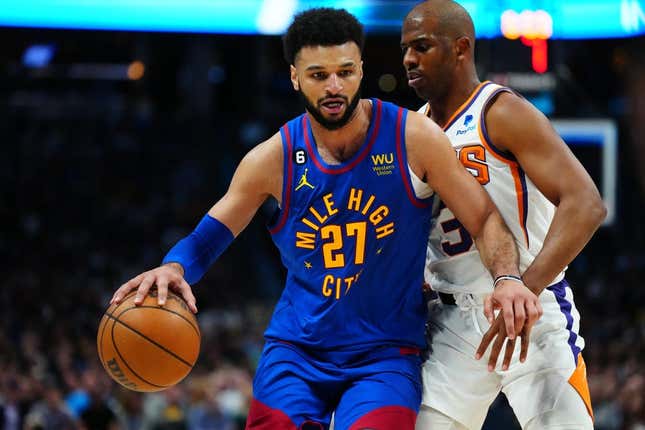 Apr 29, 2023; Denver, Colorado, USA; Denver Nuggets guard Jamal Murray (27) drives past Phoenix Suns guard Chris Paul (3) in the second half during game one of the 2023 NBA Playoffs at Ball Arena.