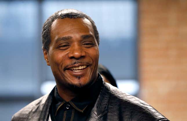 In this Friday, Feb. 10, 2017, photo, Keith Cooper, 49, smiles during a news conference in Chicago, after Indiana Gov. Eric Holcomb granted him a pardon.
