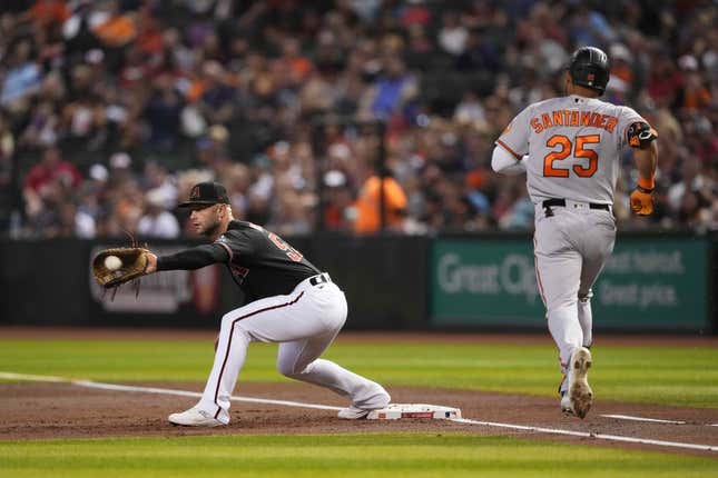 Sep 1, 2023; Phoenix, Arizona, USA; Arizona Diamondbacks first baseman Christian Walker (53) fields a throw to force out Baltimore Orioles right fielder Anthony Santander (25) during the first inning at Chase Field.