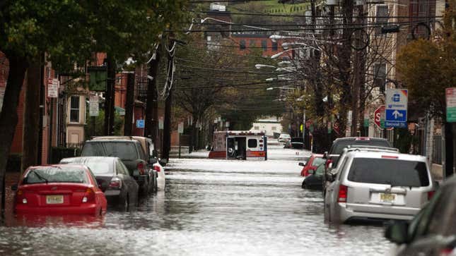An ambulance sits abandoned in the middle of a flooded street after Hurricane Sandy October 30, 2012 in Hoboken, New Jersey. 