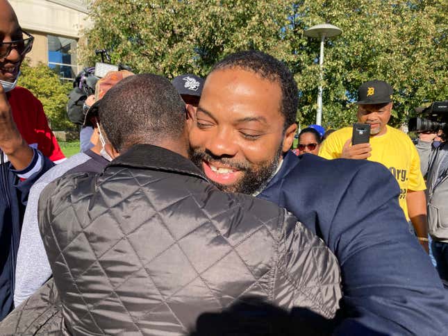 Juwan Deering gets a hug outside the courthouse in Pontiac, Michigan, on Thursday, Sept. 30, 2021, after murder charges were dropped in a fire that killed five children in suburban Detroit in 2000.