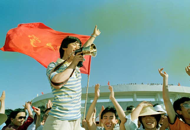 A student leader from the Political Science and Law University leads a victory cheer as hundreds of students realize they have successfully disrupted a officially sponsored pro-government rally at the Chang Ping Bicycle Stadium outside Beijing.