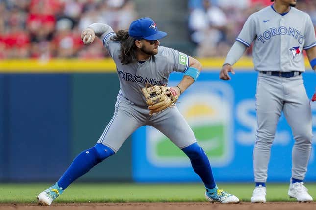 Aug 19, 2023; Cincinnati, Ohio, USA; Toronto Blue Jays shortstop Bo Bichette (11) throws to first to get the out in the third inning at Great American Ball Park.