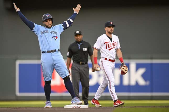 May 26, 2023; Minneapolis, Minnesota, USA;  Toronto Blue Jays outfielder George Springer (4) celebrates his double against the Minnesota Twins during the first inning at Target Field.