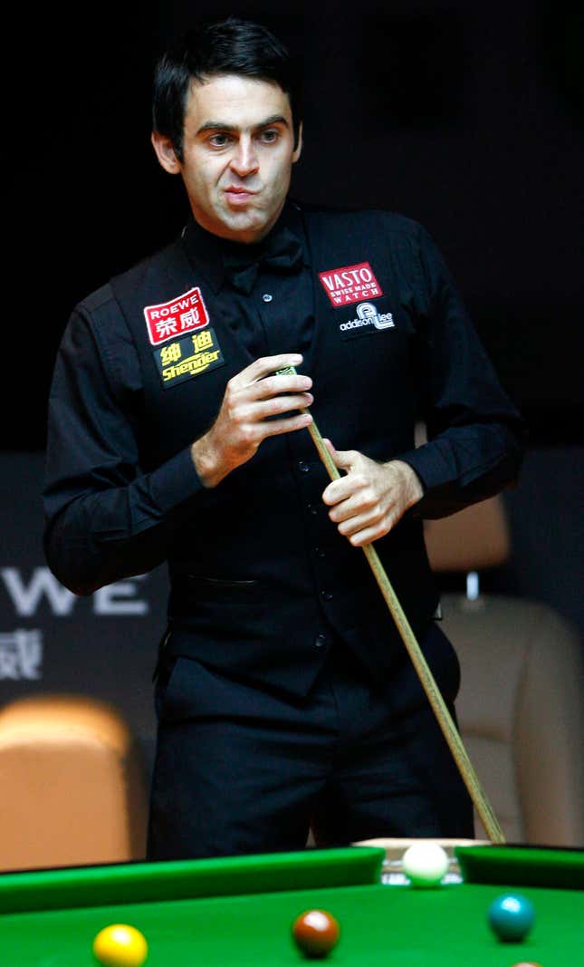 In this photo released by China's Xinhua News Agency, Ronnie O'Sullivan of England reacts during the final against his compatriot Ricky Walden in the 2008 World Snooker Roewe Shanghai Masters in east China's Shanghai, Sunday, Oct. 5, 2008. Qualifier Walden upset world champion O'Sullivan 10-8. (AP Photo/Xinhua, Fan Jun)