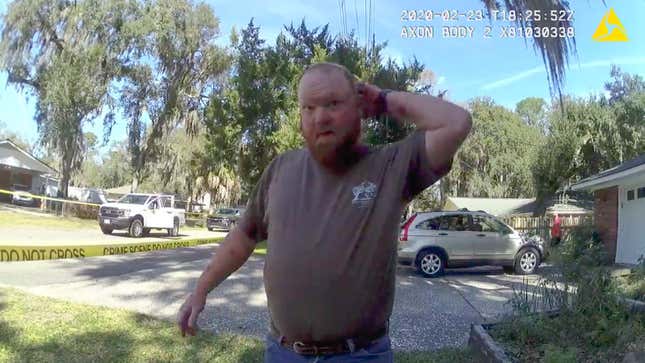 In this Feb. 23, 2020 image taken from Glynn, Ga., County Police body camera video, Travis McMichael speaks to a police officer at the scene where Ahmaud Arbery, a 25-year-old Black man, was shot and killed while while running in a neighborhood outside the port city of Brunswick, Ga. Father and son Gregory and Travis McMichael were arrested on murder charges in May, more than two months after the incident. A third man, William “Roddie” Bryan Jr., who shot cellphone video of the incident was charged with murder for joining the chase. 