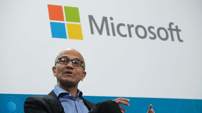Satya Nadella, CEO of Microsoft, speaks with Herbert Diess, CEO of Volkswagen AG, (not pictured) at a "fireside chat" to the media about a joint project between the two companies called the Volkswagen Automotive Cloud on February 27, 2019