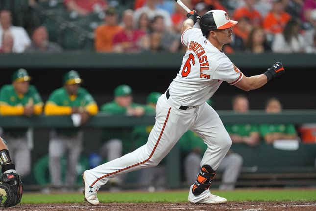 Apr 11, 2023; Baltimore, Maryland, USA; Baltimore Orioles first baseman Ryan Mountcastle (6) drives home shortstop Jorge Mateo (not shown) in the third inning against the Oakland Athletics at Oriole Park at Camden Yards.