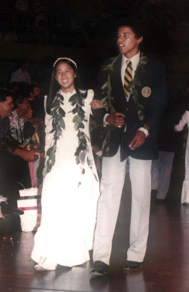Barack Obama escorts Laura Kong during the graduation ceremony at Punahou School in May 1979 in Honolulu, Hawaii.