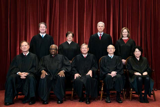 Members of the Supreme Court pose for a group photo at the Supreme Court in Washington, April 23, 2021. Seated from left are Associate Justice Samuel Alito, Associate Justice Clarence Thomas, Chief Justice John Roberts, Associate Justice Stephen Breyer and Associate Justice Sonia Sotomayor, Standing from left are Associate Justice Brett Kavanaugh, Associate Justice Elena Kagan, Associate Justice Neil Gorsuch and Associate Justice Amy Coney Barrett. The Supreme Court has ended constitutional protections for abortion that had been in place nearly 50 years — a decision by its conservative majority to overturn the court’s landmark abortion case.