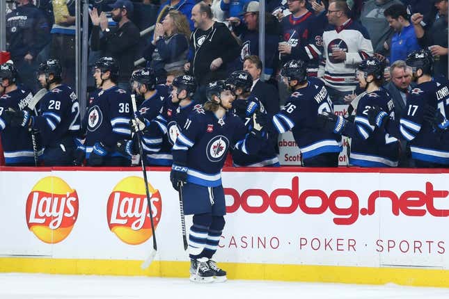 Apr 10, 2023; Winnipeg, Manitoba, CAN;  Winnipeg Jets forward Kyle Connor (81) is congratulated his team mates on his goal against the San Jose Sharks during the first period at Canada Life Centre.