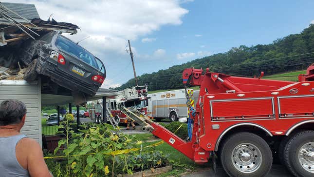 Image for article titled Another Car Has Somehow Ended Up In The Second Story Of A House