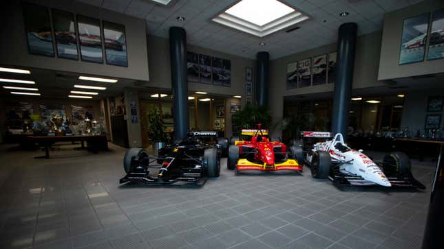 Three Championship-winning IndyCars belonging to Cristiano da Matto, Sèbastian Bourdais and Nigel Mansell in the Newman/Haas facility lobby