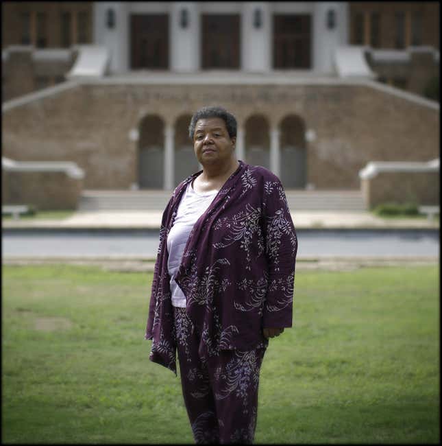 LITTLE ROCK, ARKANSAS - SEPTEMBER 13: Elizabeth Eckford poses for a portrait on September 13, 2007 in front of the main entrance of Central High School in Little Rock, Arkansas. Threading her way though an angry mob as the Arkansas National Guard looked on, Eckford was the first of nine black schoolchildren to make history on September 4th, 1957 when she arrived, alone, for the first day of classes at the all-white high school.