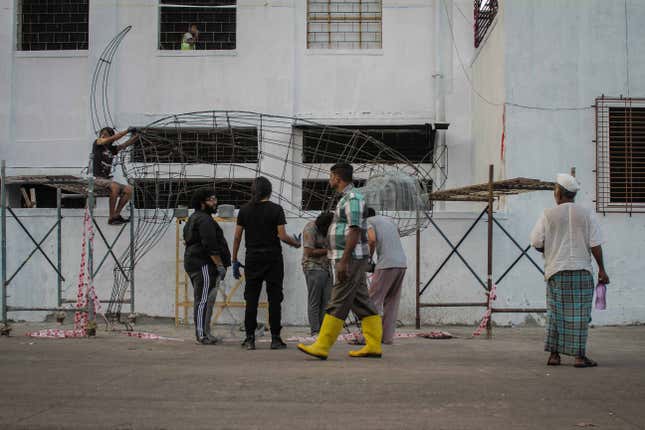 Artists at work on an installation at the Sassoon Docks.