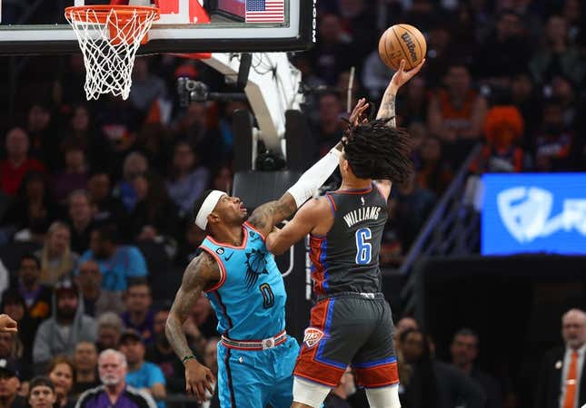 Feb 24, 2023; Phoenix, Arizona, USA; Oklahoma City Thunder forward Jaylin Williams (6) drives to the basket against Phoenix Suns forward Torrey Craig (0) in the first half at Footprint Center.