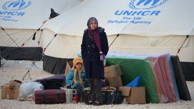 Newly arrived refugees from Syria wait for tents to go up at the Za’atari refugee camp on January 30, 2013 in Mafraq, Jordan.