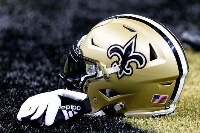 Aug 13, 2023; New Orleans, Louisiana, USA;  Detailed view of the New Orleans Saints helmet and glove during pregame against the Kansas City Chiefs at the Caesars Superdome.