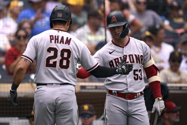 Aug 19, 2023; San Diego, California, USA; Arizona Diamondbacks designated hitter Tommy Pham (28) is congratulated by first baseman Christian Walker (53) after hitting a two-run home run against the San Diego Padres during the fifth inning at Petco Park.