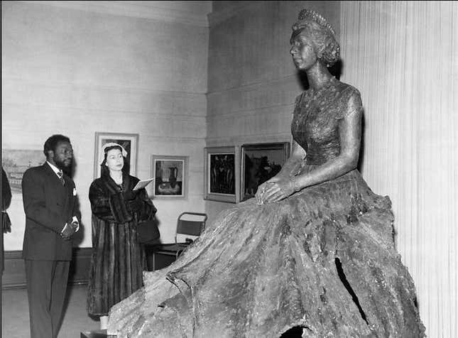 Ben Enwonwu with Queen Elizabeth II and his bronze statue of her.