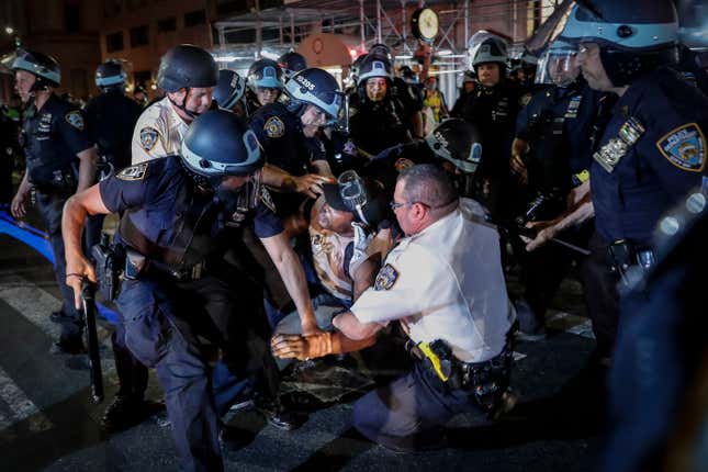A protester is arrested on New York’s Fifth Avenue by NYPD officers during a march on June 4, 2020, following the death of George Floyd.