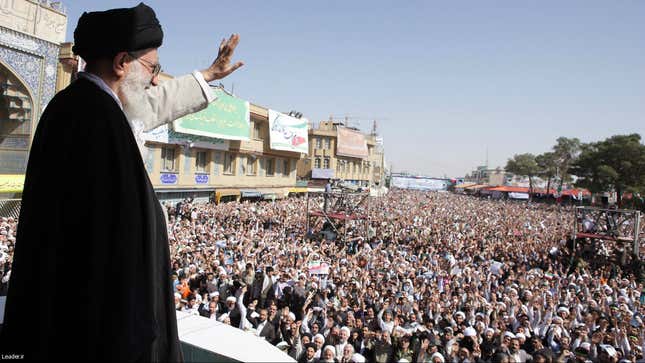 Iran's Supreme Leader Ayatollah Ali Khamenei waves to the crowd in the holy city of Qom, 120 km (75 miles) south of Tehran, October 19, 2010.