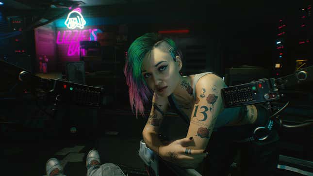 Judy looks at V in a promotional image for Cyberpunk 2077.