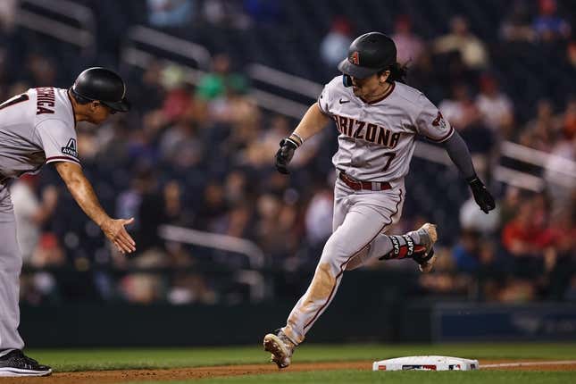 Jun 7, 2023; Washington, District of Columbia, USA; Arizona Diamondbacks left fielder Corbin Carroll (7) celebrates with third base coach Tony Perezchica (21) after hitting a two run home run against the Washington Nationals during the ninth inning at Nationals Park.