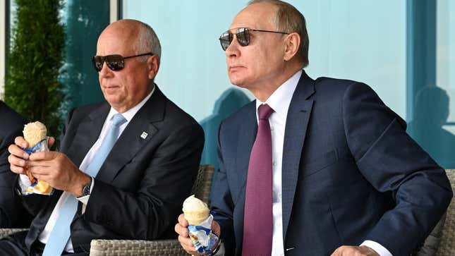 Chemezov and Putin eat ice cream as they attend an opening of the MAKS 2021 air show in Zhukovsky, outside Moscow, Russia, July 2021.
