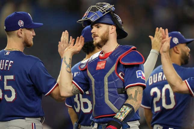 Sep 11, 2023; Toronto, Ontario, CAN; Texas Rangers catcher Jonah Heim (28) gets congratulated after a win over the Toronto Blue Jays at Rogers Centre.