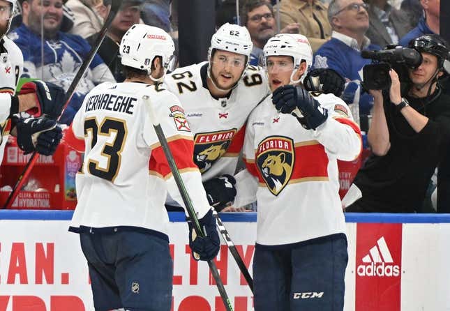 May 2, 2023; Toronto, Ontario, CANADA;   Florida Panthers forward Carter Verhaeghe (23) celebrates at the bench with defensemen Gustav Forsling (42) and Brandon Montour  (62) after scoring against the Toronto Maple Leafs in the second period in game one of the second round of the 2023 Stanley Cup Playoffs at Scotiabank Arena.