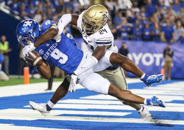 Kentucky Wildcats wide receiver Tayvion Robinson (9) makes a late second quarter touchdown catch over Akron Zips cornerback Darrian Lewis (24) to put the Cats up by two touchdowns in the first half in Saturday&#39;s game at Kroger Field in Lexington. Sept. 16, 2023