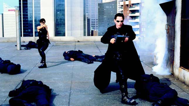 Trinity and Neo fight on a roof.