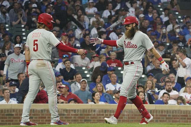 Jun 27, 2023; Chicago, Illinois, USA; Philadelphia Phillies center fielder Brandon Marsh (16) is greeted by second baseman Bryson Stott (5) after hitting a two-run homer against the Chicago Cubs during the fifth inning at Wrigley Field.