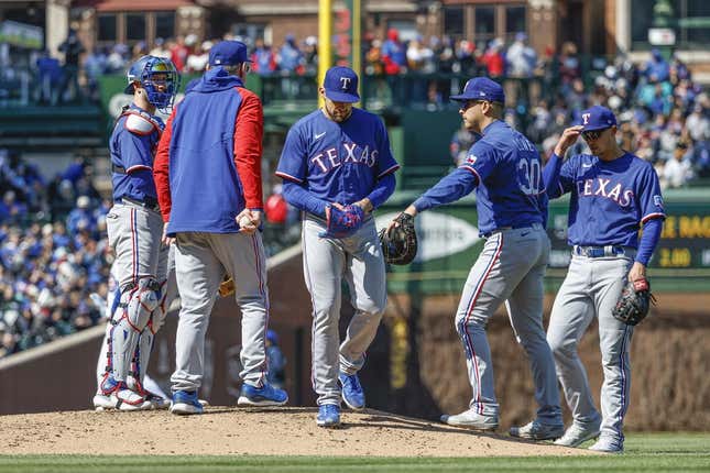 Apr 7, 2023; Chicago, Illinois, USA; Texas Rangers starting pitcher Nathan Eovaldi (17) leaves a baseball game against the Chicago Cubs during the sixth inning at Wrigley Field.
