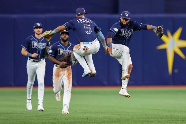 Apr 24, 2023; St. Petersburg, Florida, USA;  Tampa Bay Rays shortstop Wander Franco (5) and Tampa Bay Rays center fielder Manuel Margot (13) celebrate after beating the Houston Astros at Tropicana Field.