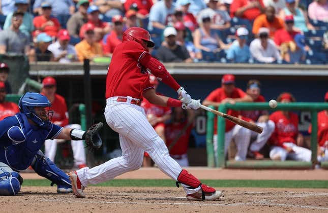 Mar 28, 2023; Clearwater, Florida, USA;  Philadelphia Phillies first baseman Darick Hall (24) singles during the fourth inning against the Toronto Blue Jays at BayCare Ballpark.