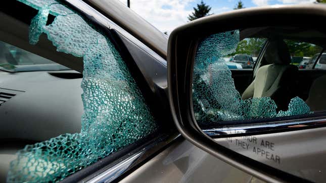 A photo of a smashed car window. 