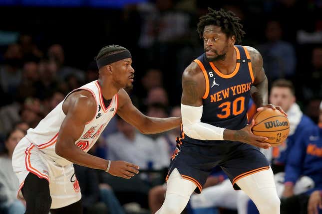 Mar 29, 2023; New York, New York, USA; New York Knicks forward Julius Randle (30) controls the ball against Miami Heat forward Jimmy Butler (22) during the first quarter at Madison Square Garden.