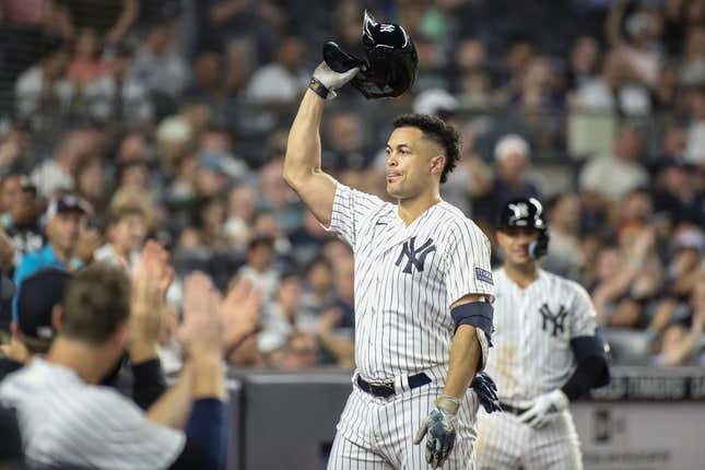 Sep 5, 2023; Bronx, New York, USA;  New York Yankees designated hitter Giancarlo Stanton (27) gives the fans a curtain call after hitting a two run home run in the sixth inning for his 400th career home run against the Detroit Tigers at Yankee Stadium.
