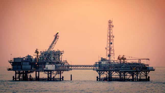 An oil platform in the Gulf of Mexico, at sunset. I.e. a visual metaphor for sunsetting fossil fuels.