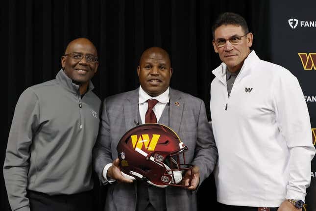 Feb 23, 2023; Ashburn, Virginia, USA; Eric Bieniemy (M) poses with Washington Commanders general manager Martin Mayhew (L) and Commanders head coach Ron Rivera (R) after being introduced as the new Commanders offensive coordinator and assistant head coach during an introductory press conference at Commanders Park.