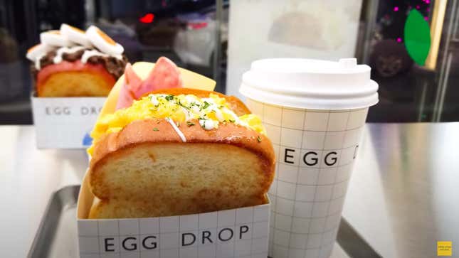 Egg Drop egg sandwich and cup of coffee