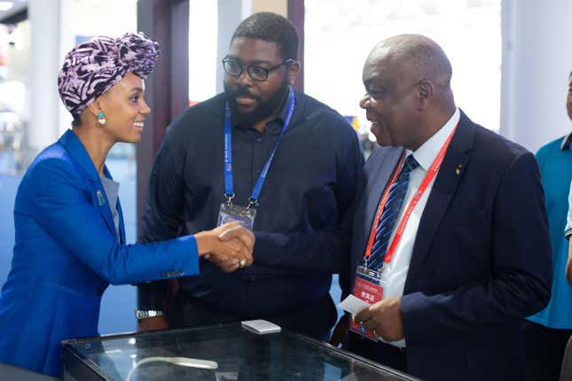 Hannah Wanjie Ryder is pictured shaking hands with delegates.